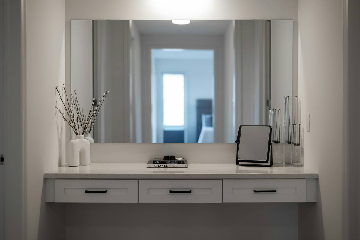 Infographic showing ideal crystal placements in beauty spaces: amethyst by night creams, rose quartz near facial tools, clear quartz beside mirrors