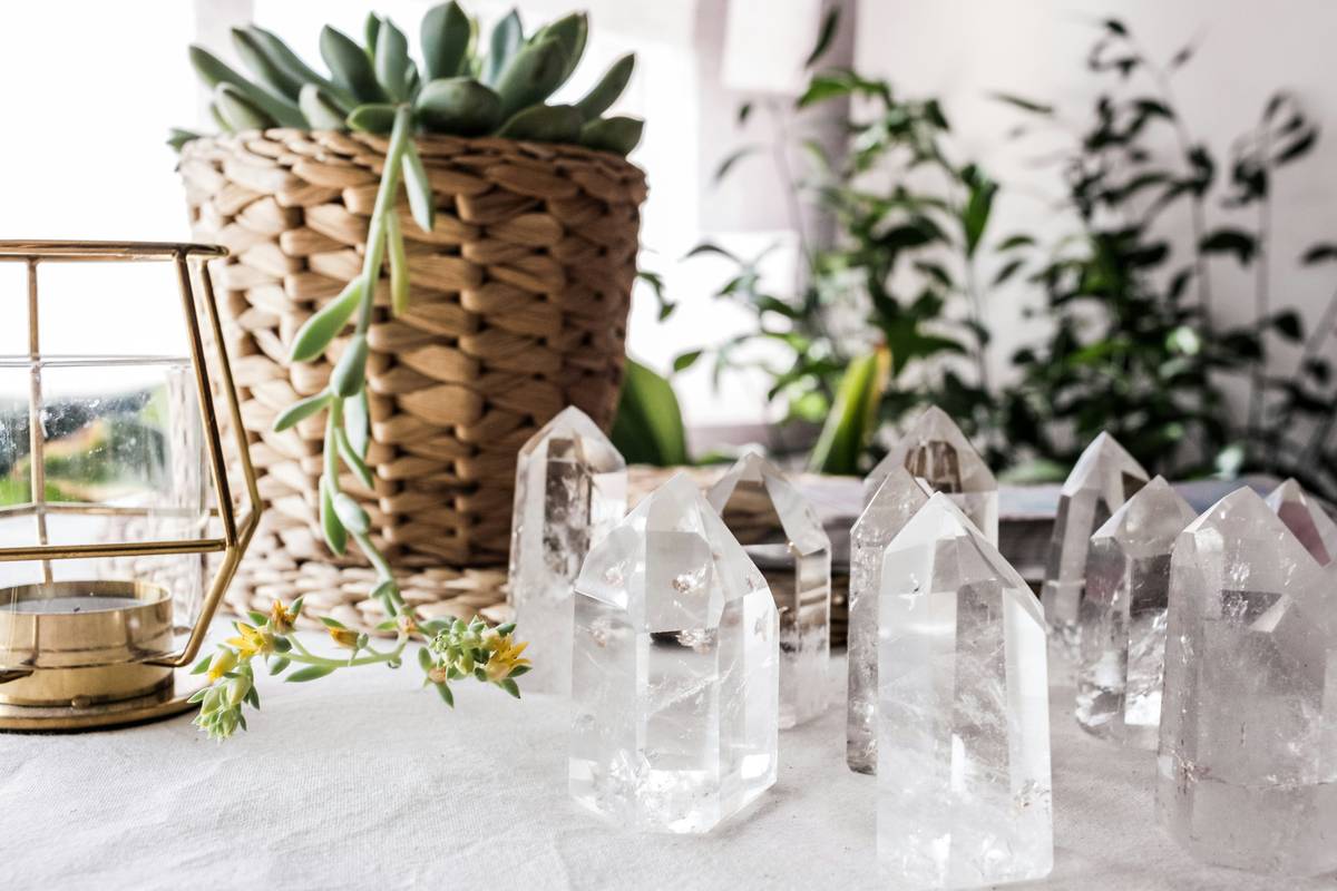 naturally glowing crystal decor styled against dark textured wall with focused ambient lighting creating soft halo effect